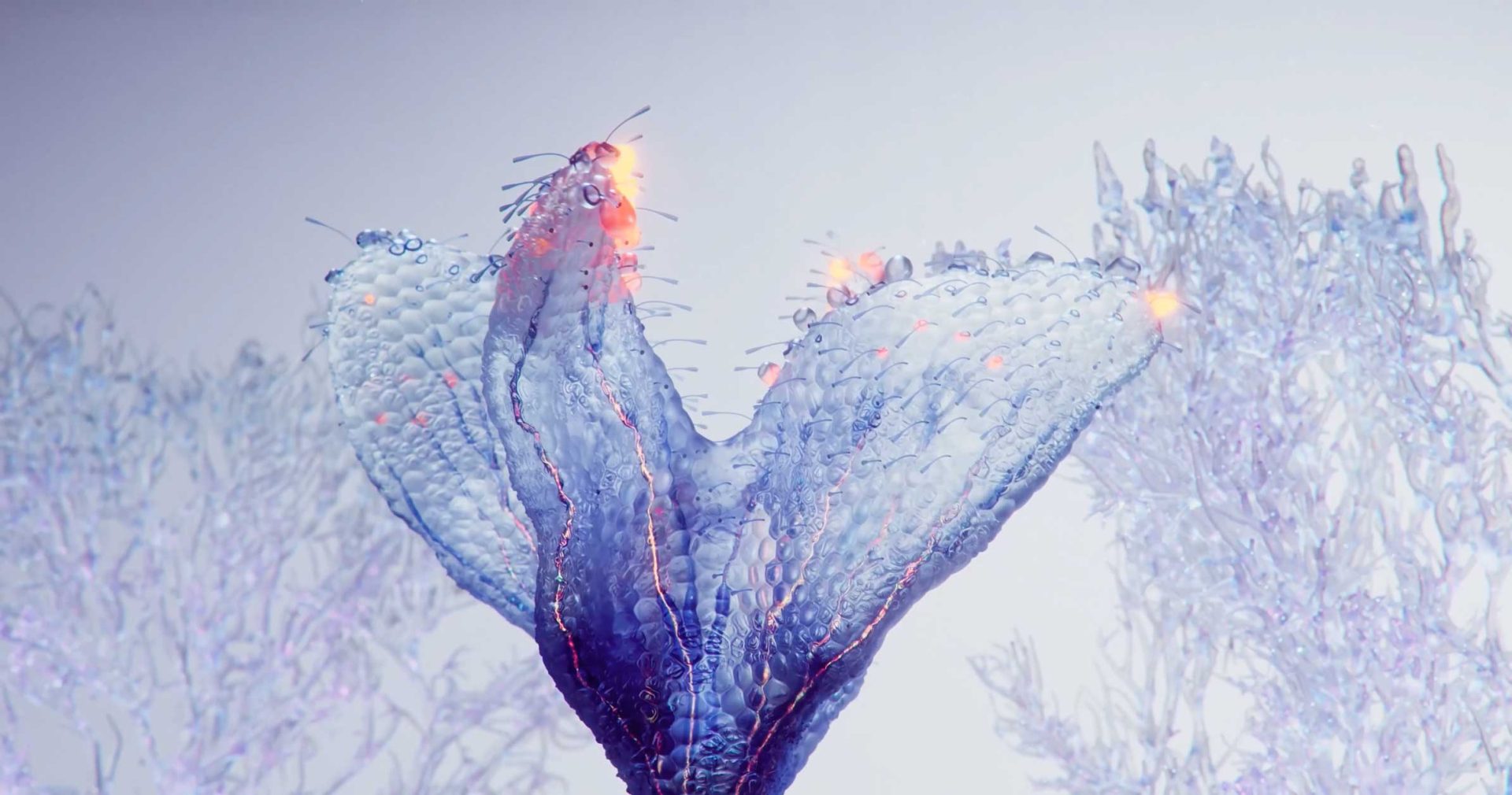 A translucent, blue, petal-like structure with glowing orange edges stands amidst abstract, branch-like forms in the FutureDeluxe London Hub style. Frame from Stash Magazine article.