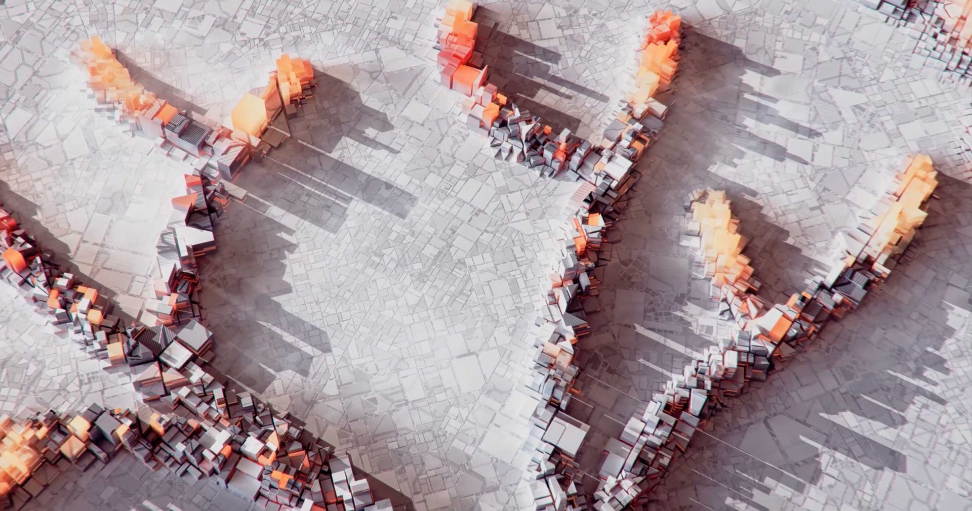 An aerial view of a FutureDeluxe geometric, tree-like structure made of orange and gray blocks rising from a flat, fragmented surface. Frame from Stash Magazine article.