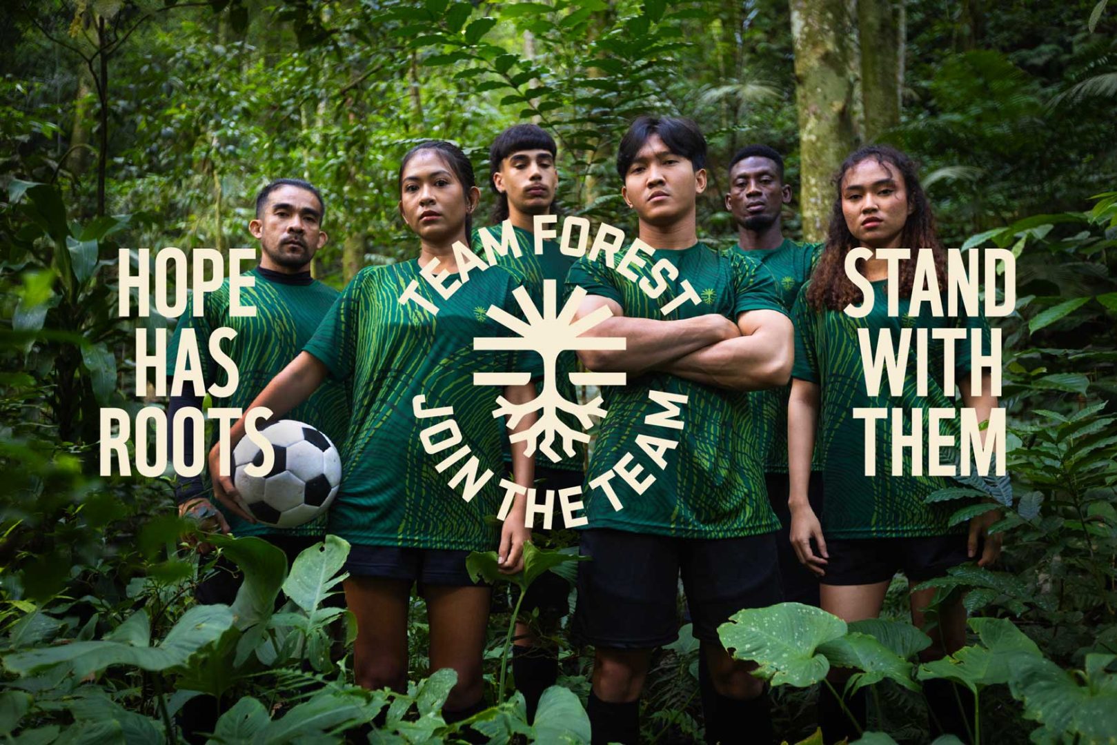 Six people in green soccer uniforms stand in a lush forest, some holding a soccer ball beneath the rainforest canopy. Text reads: Hope has roots, Team Forest, Join the Team, Stand with them, and WWF. Frame from Stash Magazine article.